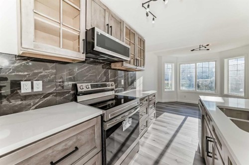 289 Canals Circle Sw, Airdrie, AB - Indoor Photo Showing Kitchen With Double Sink With Upgraded Kitchen