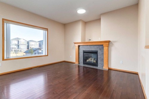 756 Luxstone Landing Sw, Airdrie, AB - Indoor Photo Showing Living Room With Fireplace