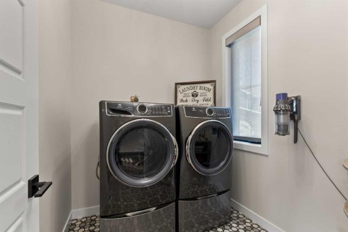 32 Monterra Landing, Rural Rocky View County, AB - Indoor Photo Showing Laundry Room