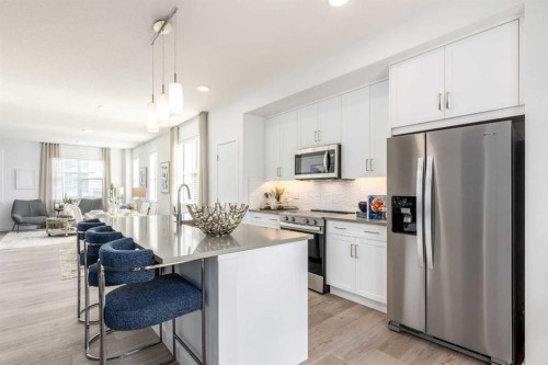 309-437 Alpine Avenue Sw, Calgary, AB - Indoor Photo Showing Kitchen With Upgraded Kitchen