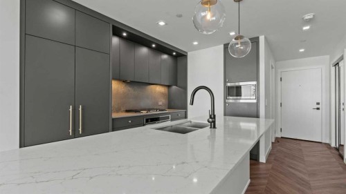 615-8505 Broadcast Avenue Sw, Calgary, AB - Indoor Photo Showing Kitchen With Double Sink With Upgraded Kitchen