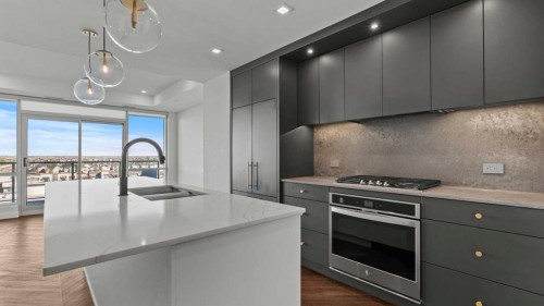 615-8505 Broadcast Avenue Sw, Calgary, AB - Indoor Photo Showing Kitchen With Double Sink With Upgraded Kitchen