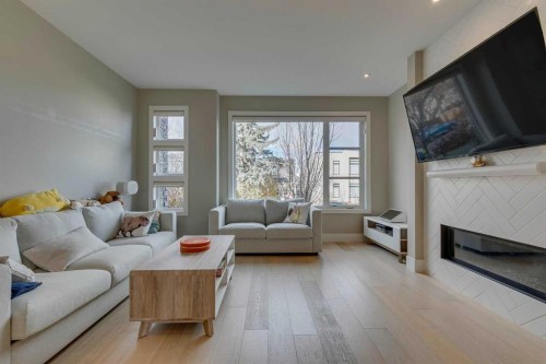 1605 29 Avenue Sw, Calgary, AB - Indoor Photo Showing Living Room With Fireplace