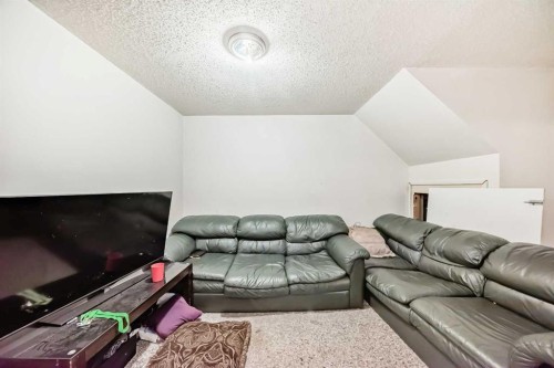 11 Falsby Way Ne, Calgary, AB - Indoor Photo Showing Living Room