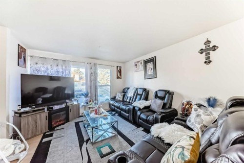 11 Falsby Way Ne, Calgary, AB - Indoor Photo Showing Living Room