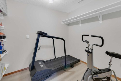 50 Christie Gardens Sw, Calgary, AB - Indoor Photo Showing Gym Room