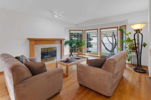 50 Christie Gardens Sw, Calgary, AB - Indoor Photo Showing Living Room With Fireplace