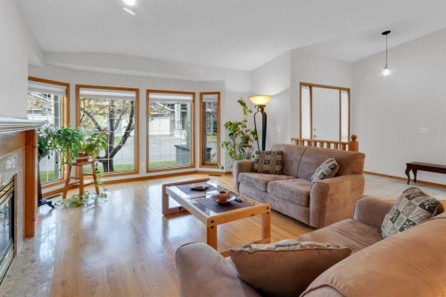 50 Christie Gardens Sw, Calgary, AB - Indoor Photo Showing Living Room With Fireplace