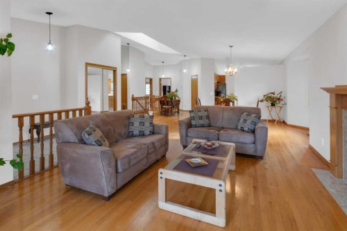 50 Christie Gardens Sw, Calgary, AB - Indoor Photo Showing Living Room With Fireplace