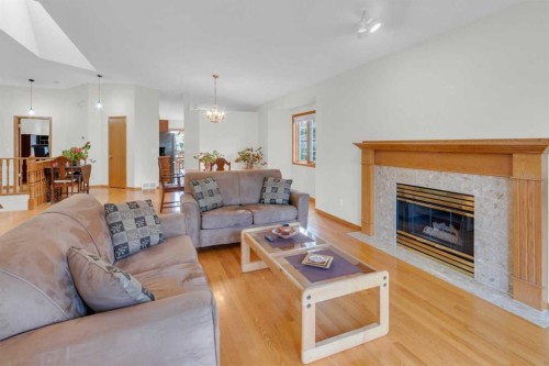 50 Christie Gardens Sw, Calgary, AB - Indoor Photo Showing Living Room With Fireplace