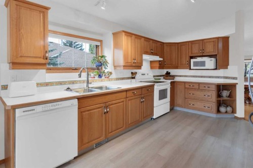 50 Christie Gardens Sw, Calgary, AB - Indoor Photo Showing Kitchen With Double Sink