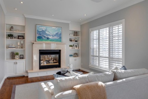 126 Eagle Ridge Drive Sw, Calgary, AB - Indoor Photo Showing Living Room With Fireplace