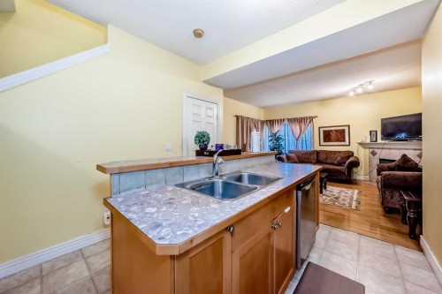 187 Bridlewood View Sw, Calgary, AB - Indoor Photo Showing Kitchen With Double Sink