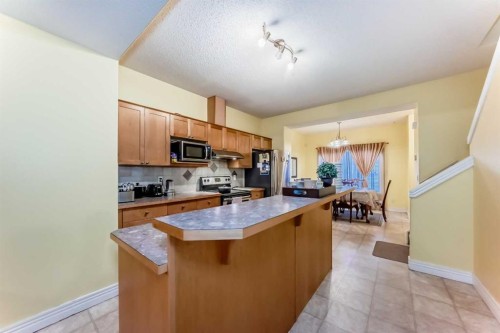 187 Bridlewood View Sw, Calgary, AB - Indoor Photo Showing Kitchen With Double Sink