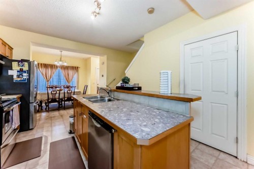 187 Bridlewood View Sw, Calgary, AB - Indoor Photo Showing Kitchen With Double Sink