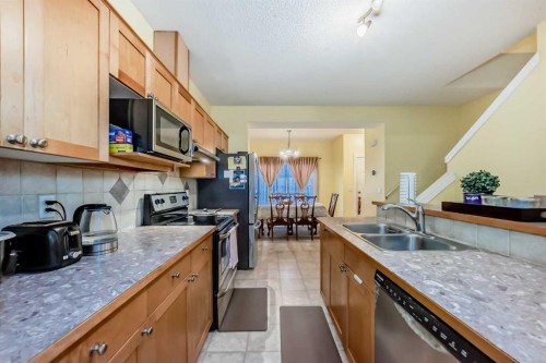 187 Bridlewood View Sw, Calgary, AB - Indoor Photo Showing Kitchen With Double Sink