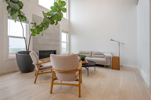 2148 Ravensdun Crescent Se, Airdrie, AB - Indoor With Fireplace