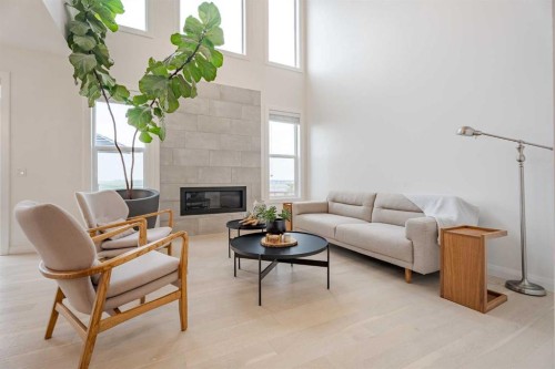 2148 Ravensdun Crescent Se, Airdrie, AB - Indoor Photo Showing Living Room With Fireplace