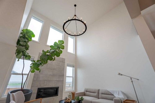 2148 Ravensdun Crescent Se, Airdrie, AB - Indoor With Fireplace