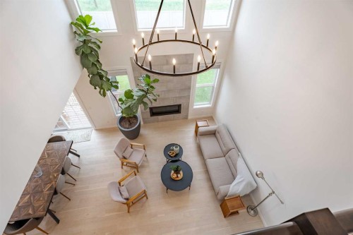 2148 Ravensdun Crescent Se, Airdrie, AB - Indoor Photo Showing Other Room With Fireplace