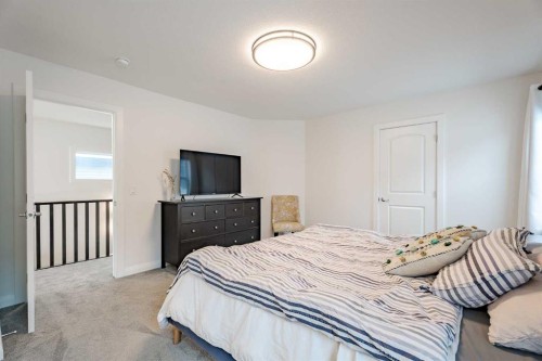 2148 Ravensdun Crescent Se, Airdrie, AB - Indoor Photo Showing Bedroom
