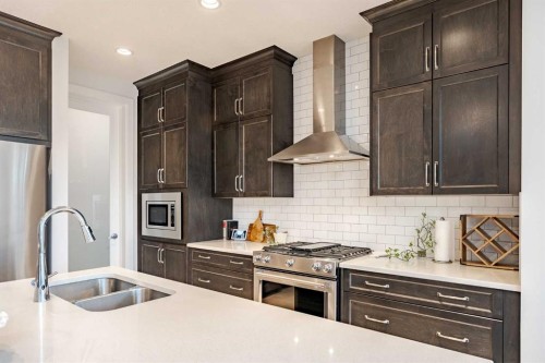2148 Ravensdun Crescent Se, Airdrie, AB - Indoor Photo Showing Kitchen With Stainless Steel Kitchen With Double Sink With Upgraded Kitchen