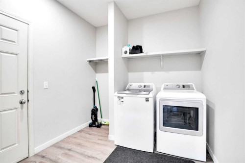 85 Boulder Creek Manor Se, Langdon, AB - Indoor Photo Showing Laundry Room