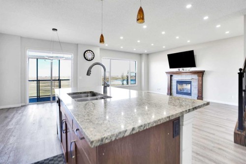 85 Boulder Creek Manor Se, Langdon, AB - Indoor Photo Showing Kitchen With Double Sink With Upgraded Kitchen