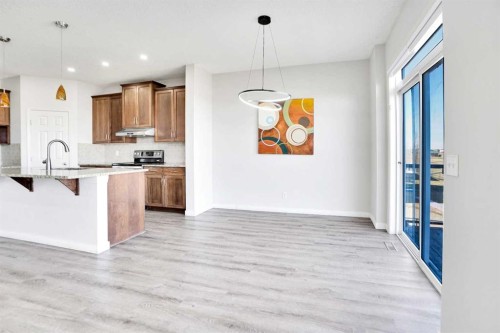 85 Boulder Creek Manor Se, Langdon, AB - Indoor Photo Showing Kitchen With Upgraded Kitchen