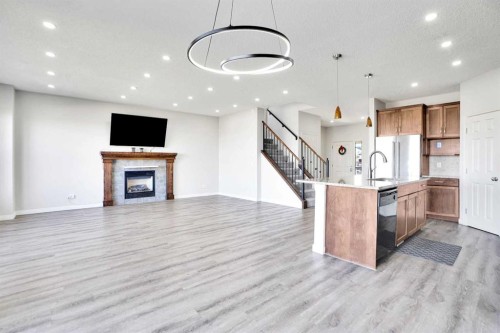 85 Boulder Creek Manor Se, Langdon, AB - Indoor With Fireplace