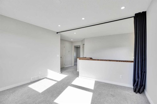 85 Boulder Creek Manor Se, Langdon, AB - Indoor Photo Showing Other Room