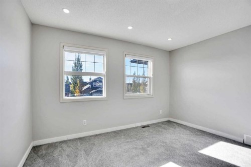 85 Boulder Creek Manor Se, Langdon, AB - Indoor Photo Showing Other Room
