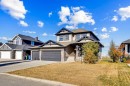 85 Boulder Creek Manor Se, Langdon, AB  - Outdoor With Facade 