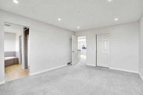 85 Boulder Creek Manor Se, Langdon, AB - Indoor Photo Showing Other Room