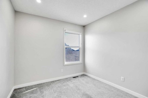 85 Boulder Creek Manor Se, Langdon, AB - Indoor Photo Showing Other Room
