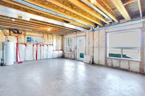 85 Boulder Creek Manor Se, Langdon, AB - Indoor Photo Showing Basement