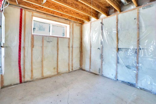 85 Boulder Creek Manor Se, Langdon, AB - Indoor Photo Showing Basement