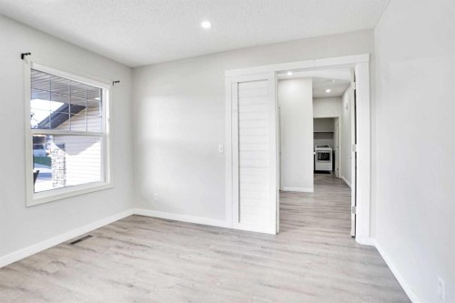 85 Boulder Creek Manor Se, Langdon, AB - Indoor Photo Showing Other Room