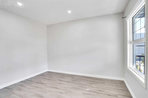 85 Boulder Creek Manor Se, Langdon, AB - Indoor Photo Showing Other Room
