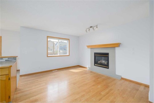 6013 Saddlehorn Drive Ne, Calgary, AB - Indoor Photo Showing Living Room With Fireplace
