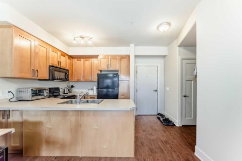 1321 18 Avenue, Didsbury, AB - Indoor Photo Showing Kitchen With Double Sink