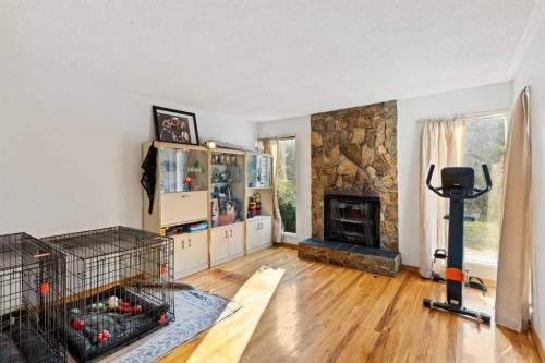 89 Edgedale Drive Nw, Calgary, AB - Indoor Photo Showing Living Room With Fireplace