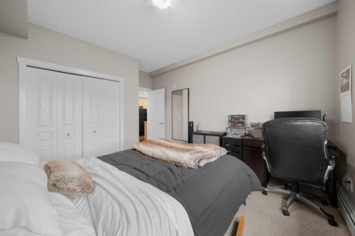 1111-211 Aspen Stone Boulevard Sw, Calgary, AB - Indoor Photo Showing Bedroom