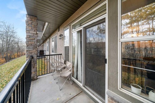 1111-211 Aspen Stone Boulevard Sw, Calgary, AB - Outdoor With Deck Patio Veranda With Exterior