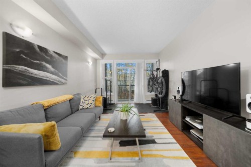 1111-211 Aspen Stone Boulevard Sw, Calgary, AB - Indoor Photo Showing Living Room