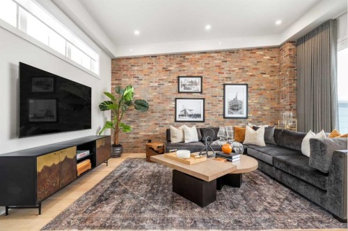 40 Greenwich Heath Nw, Calgary, AB - Indoor Photo Showing Living Room With Fireplace