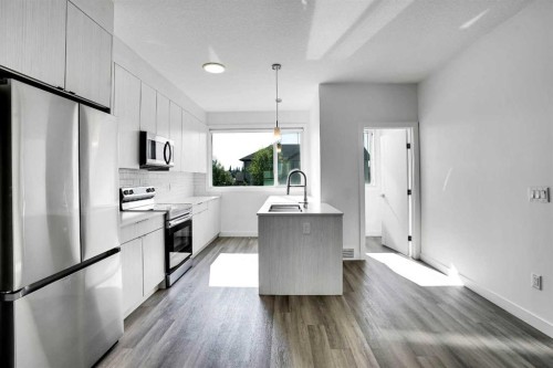 105 Panatella Square Nw, Calgary, AB - Indoor Photo Showing Kitchen With Stainless Steel Kitchen With Upgraded Kitchen