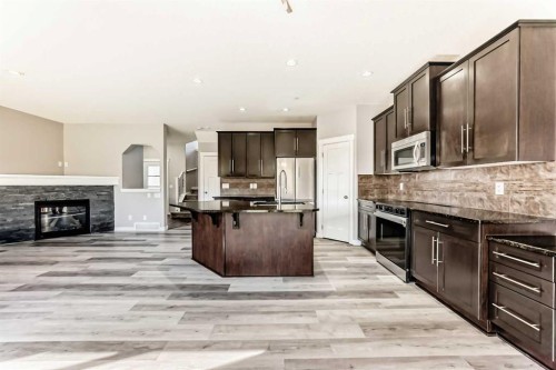 8 Lakewood Circle, Strathmore, AB - Indoor Photo Showing Kitchen With Fireplace With Upgraded Kitchen