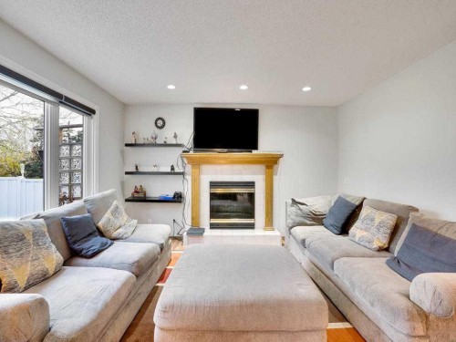 151 Citadel Park Nw, Calgary, AB - Indoor Photo Showing Living Room With Fireplace