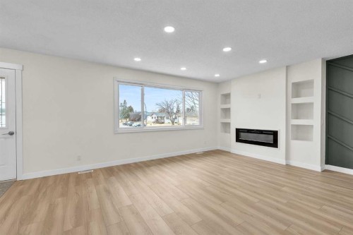 220 60 Street Se, Calgary, AB - Indoor Photo Showing Living Room With Fireplace